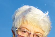 Picture of a elderly woman with white hair and glasses