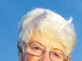 Picture of a elderly woman with white hair and glasses