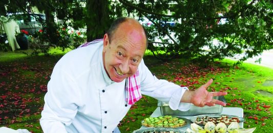 Adult Education Awards 2017 A photograph of chef Stephen Wilson leanind over a table laden with food