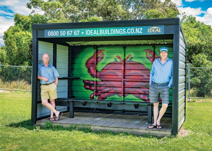 Long time Tauranga resident David Little with local, Antoon Moonen appreciating the brightly adorned side-line shelter at Te Ariki Park, painted by Tautoko Matehaere (a.k.a Sept). Photo: Andy Belcher.