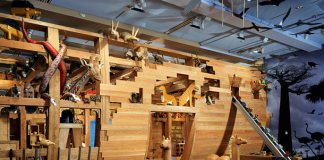 A photograph of a wooden ship under construction