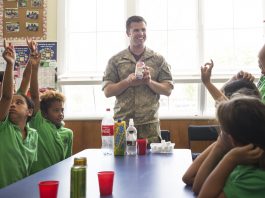 Lieutenant Timmy Reiber (BOPDHB Dental Oral Health Therapist) talks to schoolchildren about the importance of maintaining good oral health, a healthy diet and exercise
