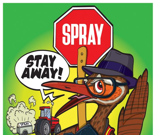 a picture of a kiwi with a red spray sign and a spray can saying stay away