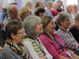 row of seated people at meeting