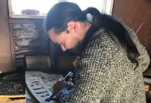 Robert Turner working on a carved piece