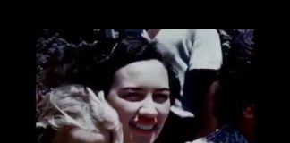 a close up shot of a woman in a crowd circa 1950's or 1960's