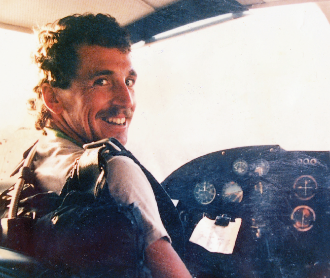 John Martin sitting at the controls of a Cesna plane