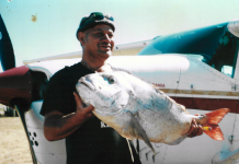 picture of a man holding a large fish