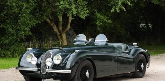 Jaguar car parked on a gravel driveway