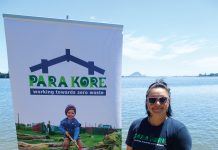 A maori woman standing next ot a sign for Para Kore Marae Incorporated Zero waste initiative