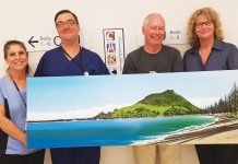 Artist Graham Baker with the painting he’s gifted to Tauranga Hospital’s Coronary Care Unit in recognition of the care he received after having a heart attack last year. Pictured left to right: Clinical Physiologist Michelle Bayles, Cardiology Clinical Nurse Manager Jason Money, Graham and CCU Clinical Nurse Manager Chris Southerwood.