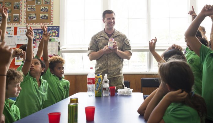 Lieutenant Timmy Reiber (BOPDHB Dental Oral Health Therapist) talks to schoolchildren about the importance of maintaining good oral health, a healthy diet and exercise