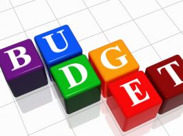 A set of coloured alphabet blocks spelling out the word budget