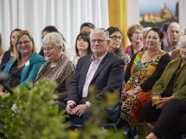 A group of people at a town meeting