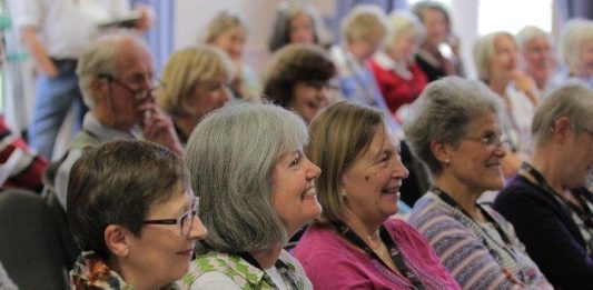 row of seated people at meeting