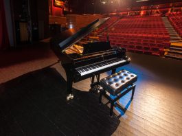 picture of a grand piano in a theatre