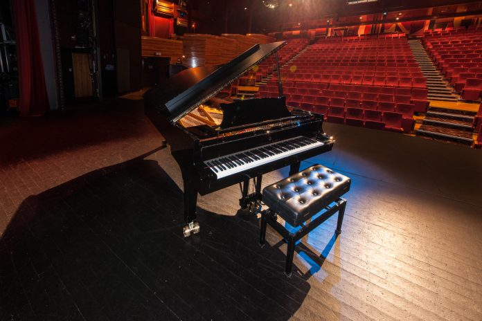 picture of a grand piano in a theatre