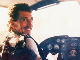 John Martin sitting at the controls of a Cesna plane